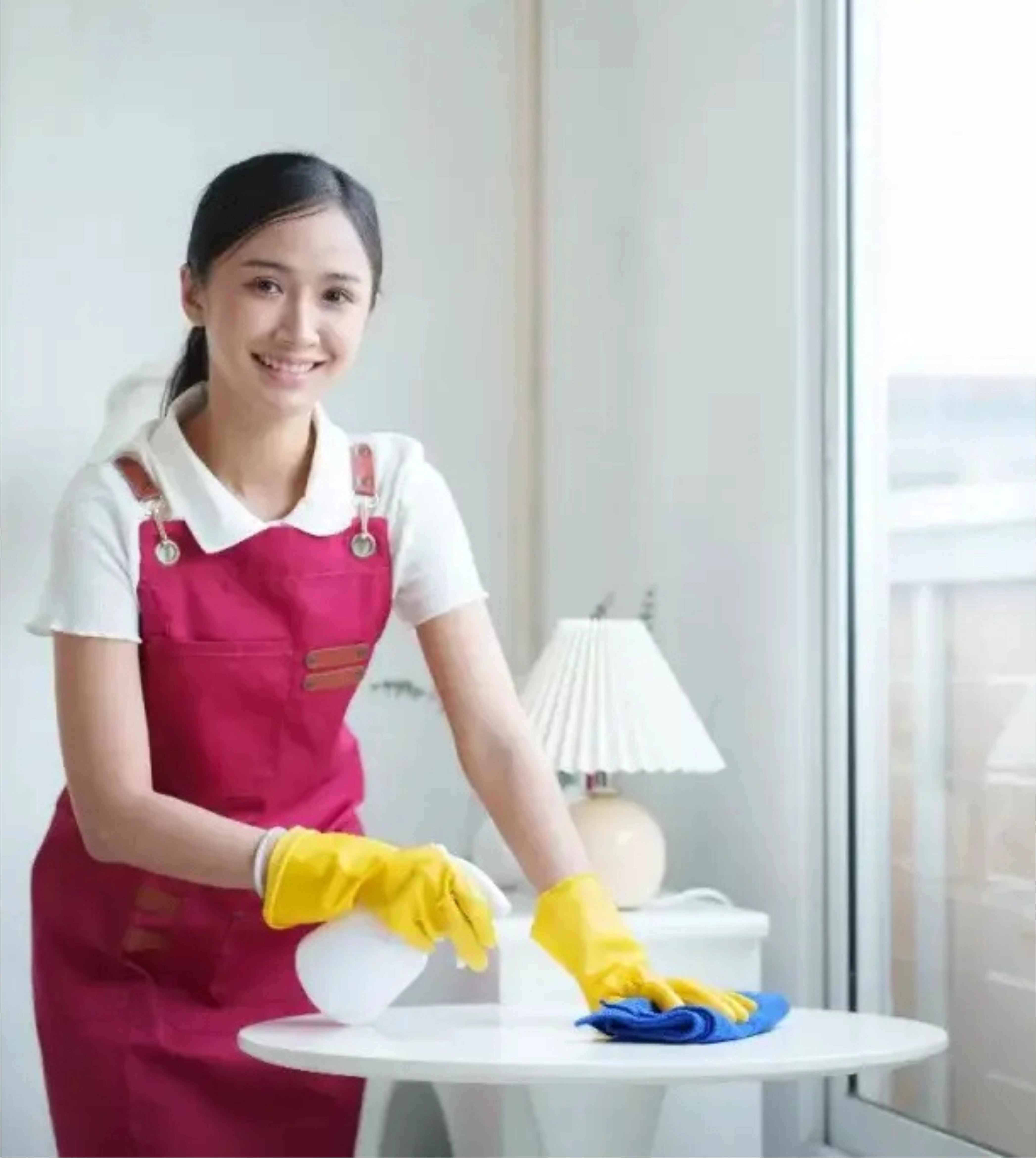 A man in a wheelchair is being pushed by a woman in a pink shirt.
